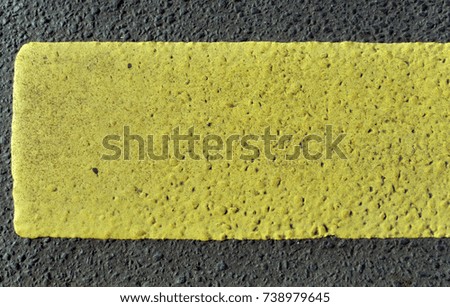 asphalt with yellow stripe