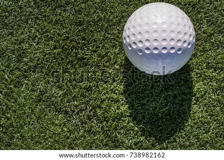 golf ball on green background