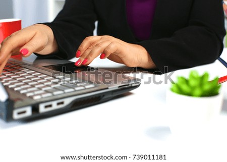 the woman behind the desk in the Office
