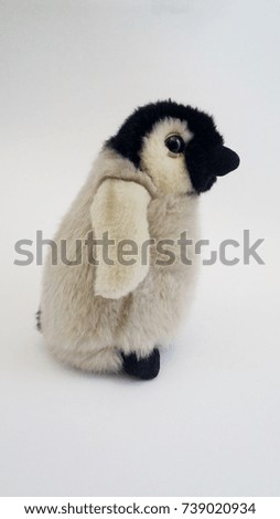 Penguin doll on white background