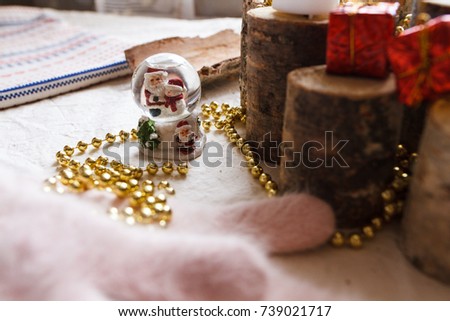 New Year composition from toys, wood, mittens, beads and postcards