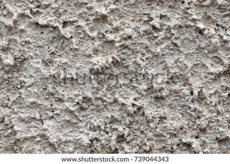 Grey plaster background, cracked and textured leaden cement. Stucco texture, imitating drawing of boiling, bubbles, giving base beautiful relief. Rough top monochrome empty brushed grunge crack home 