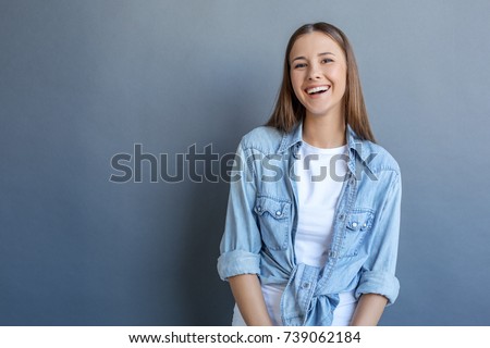 Young woman free style isolated on grey
