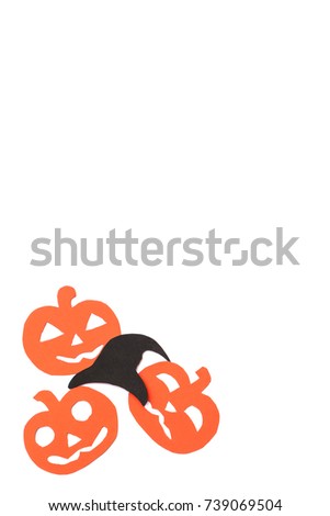 Silhouettes of orange pumpkins and black hat carved out of black paper are isolated on white for Halloween festival. Halloween concept