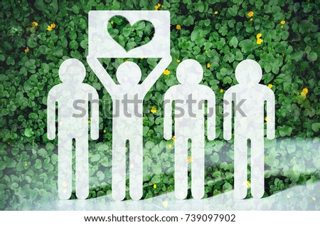 Green peace concept. Paper people on green grass on bright background. Greenpeace, a symbol of the heart from the grass. Love and protection of nature and ecology. Royalty-Free Stock Photo #739097902