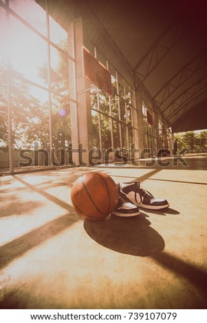 Basketball court with ball and shoes