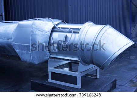 large galvanized pipe system for extracting air from the room
