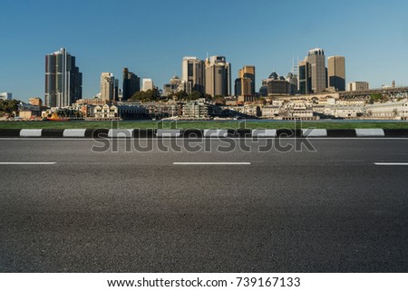 empty asphalt road with modern cityscape skyline in daytime, empty highway roadside with urban city skyscraper in Sydney