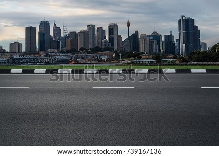 empty asphalt road with modern cityscape skyline in morning, empty highway roadside with urban city skyscraper in Sydney