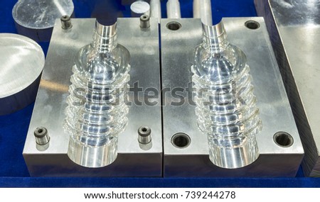 Fine surface after grid steel hardening tooling with guide bush and pin for plastic bottle injection machine ; selective focus ; industrial background Royalty-Free Stock Photo #739244278