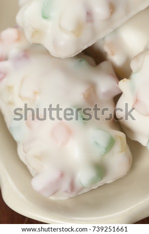Dessert with candied fruit and sugar icing, closeup