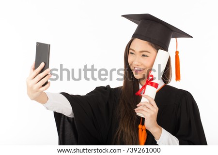 Beautiful Attractive Asian Graduated woman in cap and gown smile and take a selfie feeling so proud and happiness,Isolated on white background,Education Success concept