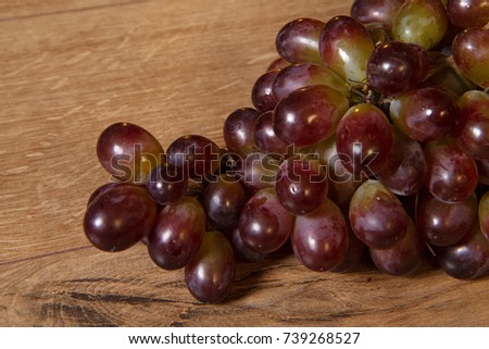 Ukrainian grapes on a wooden background