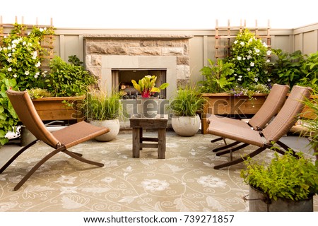 An outdoor patio complete with gas fireplace. 