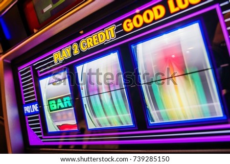 Spinning Slot Machine Drums. Las Vegas One Handed Bandit Slot Game. Royalty-Free Stock Photo #739285150
