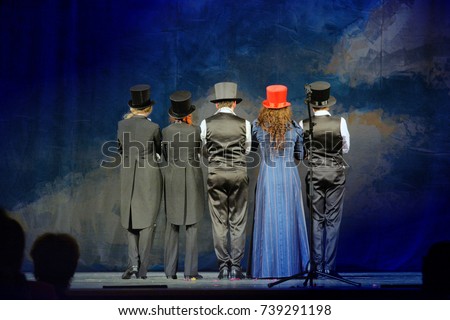 the actors turned their backs to the audience at the theater Royalty-Free Stock Photo #739291198