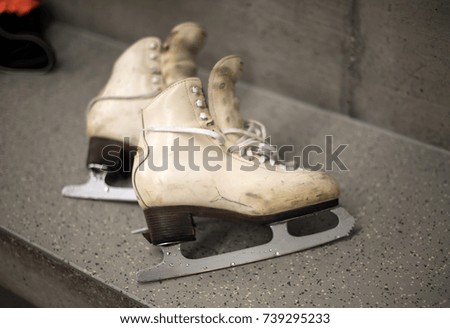 Professional ice skating shoes in dressing room after training