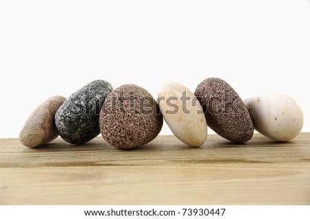 Set of colored stones on a wood board