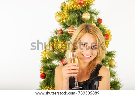 Beautiful woman with glass of wine christmas tree