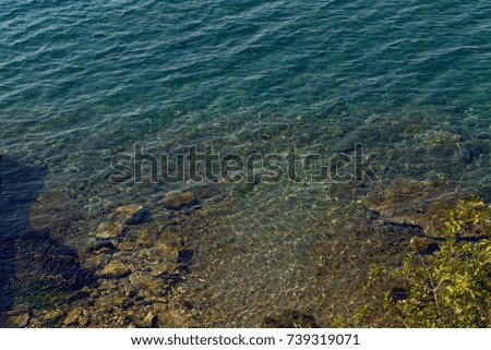 sea with a stone bottom and a blue clear water off the coast of Montenegro