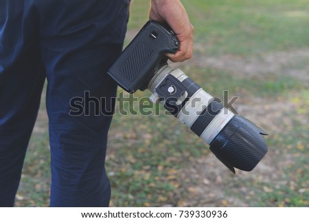 Camera on hand, Landscape photographer, Nature photographer, Professional photographer works