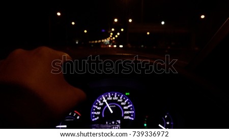 Hand on steering wheel close up