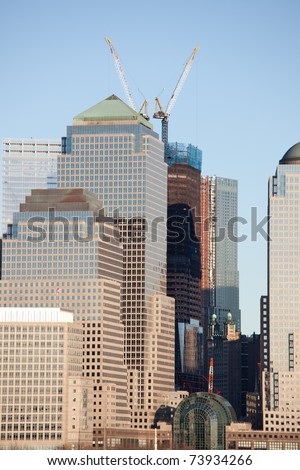 March 2011. Manhattan, lower New York financial offices(downtown) over Hudson river panorama from Jersey city. One World Trade Center building under construction