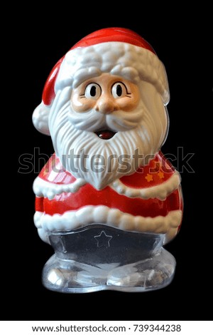 plastic Santa Claus toy isolated on black background