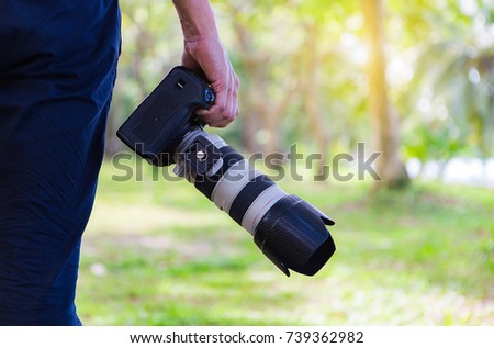Photography holding camera on the park,travel concept