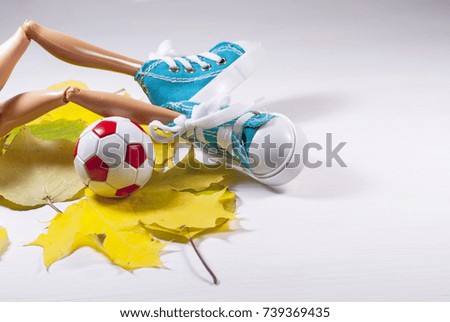 sneakers. football. soccer ball. autumn. yellow leaves