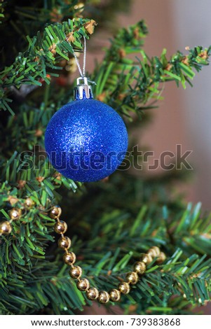 glass ball and decorations on Christmas tree 