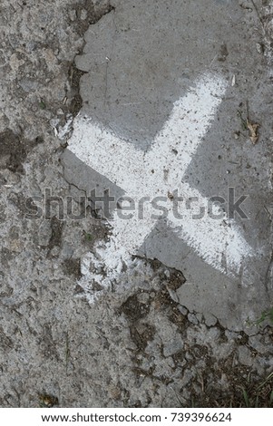 Cross white paint on concrete