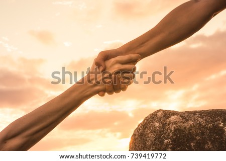 Giving a helping hand. Royalty-Free Stock Photo #739419772