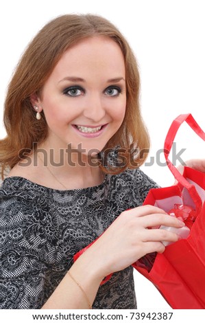 portrait of young woman with shopping bags over white background