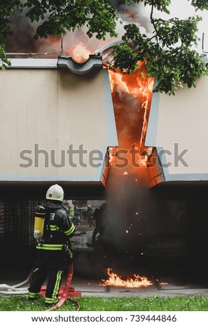 Firemen trying to extinguish a garage fire in Ljubljana, Slovenia. Detail of the part of the garage that is on fire.
