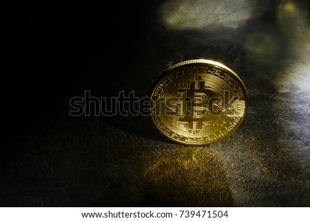 Golden bitcoins with the spotlight 