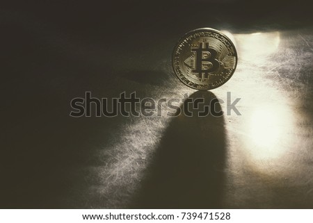 Golden bitcoins with the spotlight 