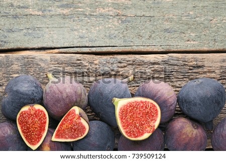 Ripe and sweet figs on wooden table
