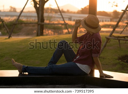 Photographer Women on the prairie at sunset.