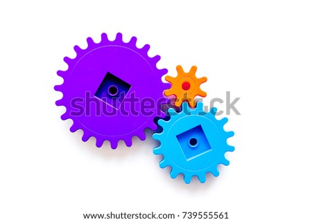 Moving forward concept with gears. Right decision and correct solution. white desk background top view mockup