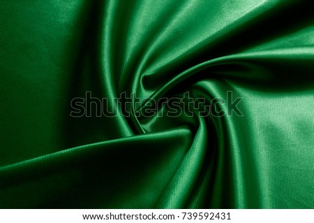  Texture of green silk fabric. Beautiful emerald green soft silk fabric.