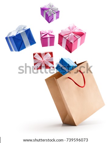 Gift boxes pop out from paper bag isolated on white background Royalty-Free Stock Photo #739596073