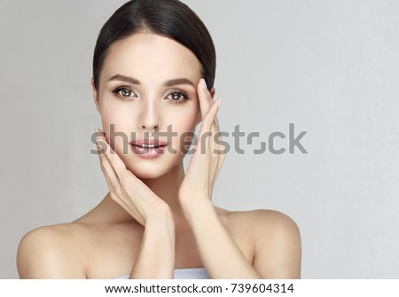 Beautiful Young Woman with Clean Fresh Skin . Facial  treatment   . Cosmetology , beauty  and spa .  Skin care . Beauty skin famale  face Royalty-Free Stock Photo #739604314