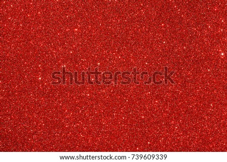 Red (ruby) glitter background. Sparkle texture. Abstract twinkle background for New Years or Christmas holiday.
