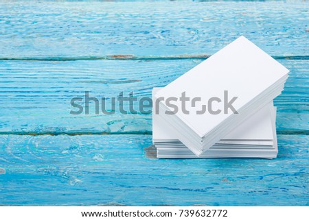 Blank business cards on the wooden table. Template for ID. Top view