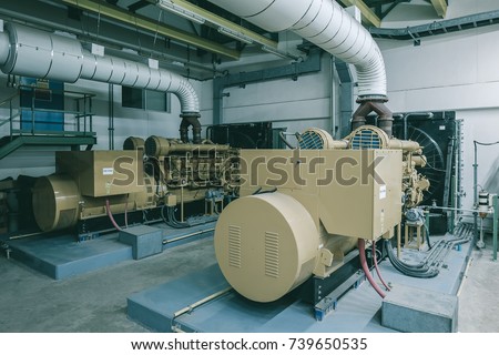 Generator room with two generators in factory standby for power backup, Diesel generator Royalty-Free Stock Photo #739650535