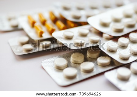 Different medicines: tablets, pills in blister pack, medications drugs, macro, selective focus, copy space Royalty-Free Stock Photo #739694626