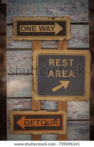 one way and rest area sign