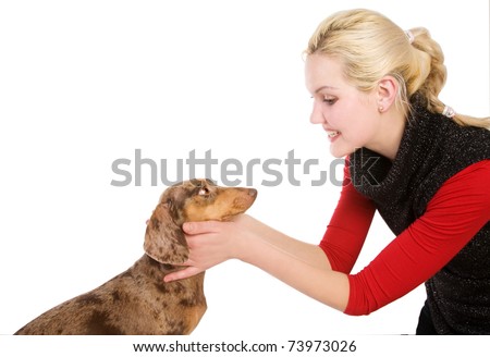 Beautiful blonde girl with badger-dog