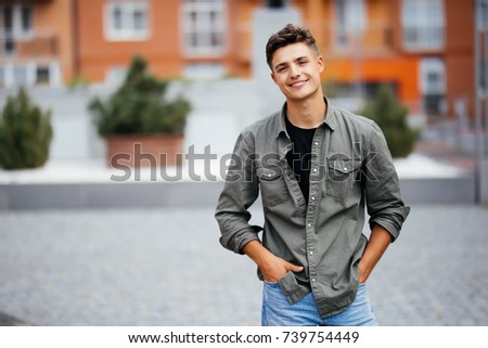 Handsome smiling young man portrait. Cheerful men looking at camera Royalty-Free Stock Photo #739754449